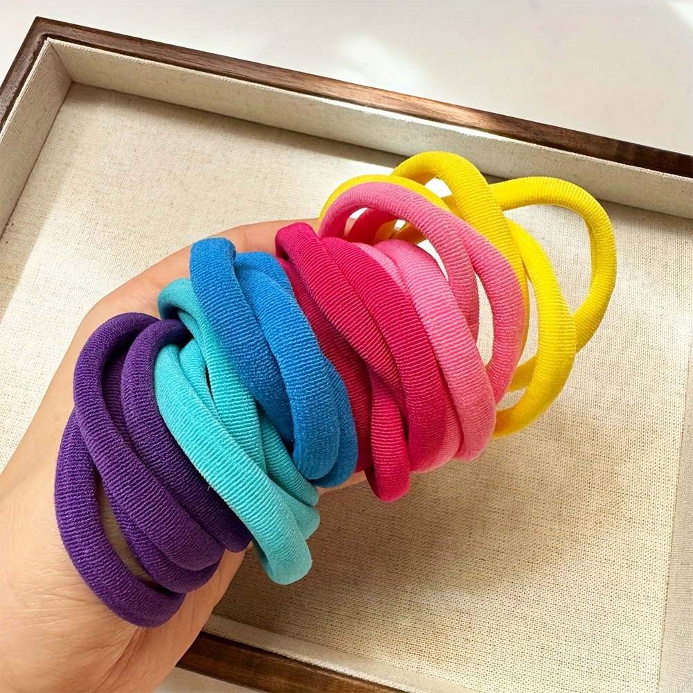 A Set Of 24 Vibrant Hair Ties That Are Stylish And Elastic, Featuring Large Colorful Bands Suitable For Hairstyles