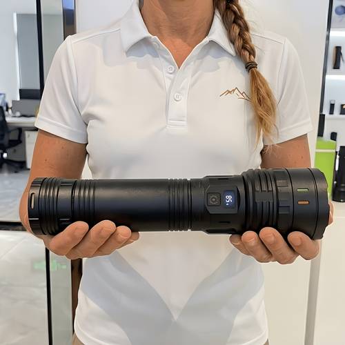 a large black flashlight with a portable shoulder strap built in high capacity battery for long 4 lighting high display usb charging and adjustable zoom suitable for outdoor and night work