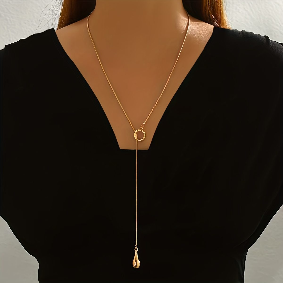 Image of A Minimalist -shaped Necklace For Women Featuring A Fashionable Geometric Teardrop Pendant, A Round Snake Metal Chain, And An Adjustable Long Length, Perfect As A Versatile Accessory For Everyday