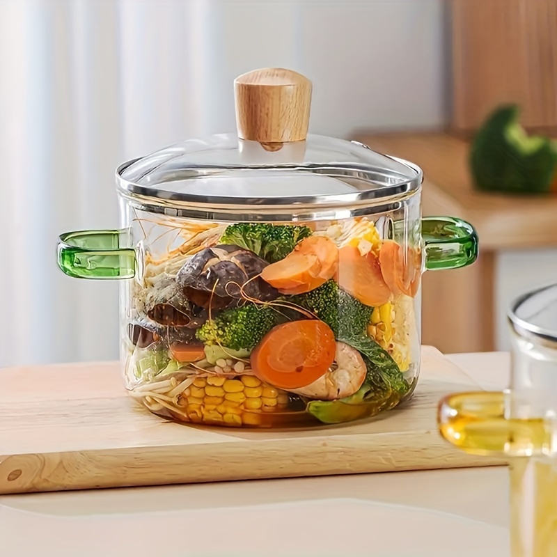 A Double-handled Glass Soup Pot With A Wooden Handle On Is Perfect For Home Kitchens. The Color Of Handles . It Has A Capacity Of 1500ml And Is Suitable For 1 To 2 People.
