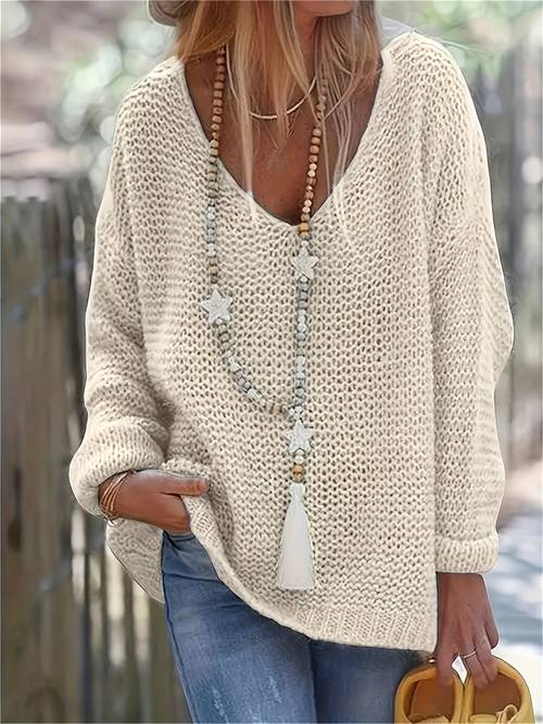 elegant beige v neck knit sweater for women chic long sleeve loose fit lightweight acrylic blouse with beaded necklace star pendant detail spring autumn