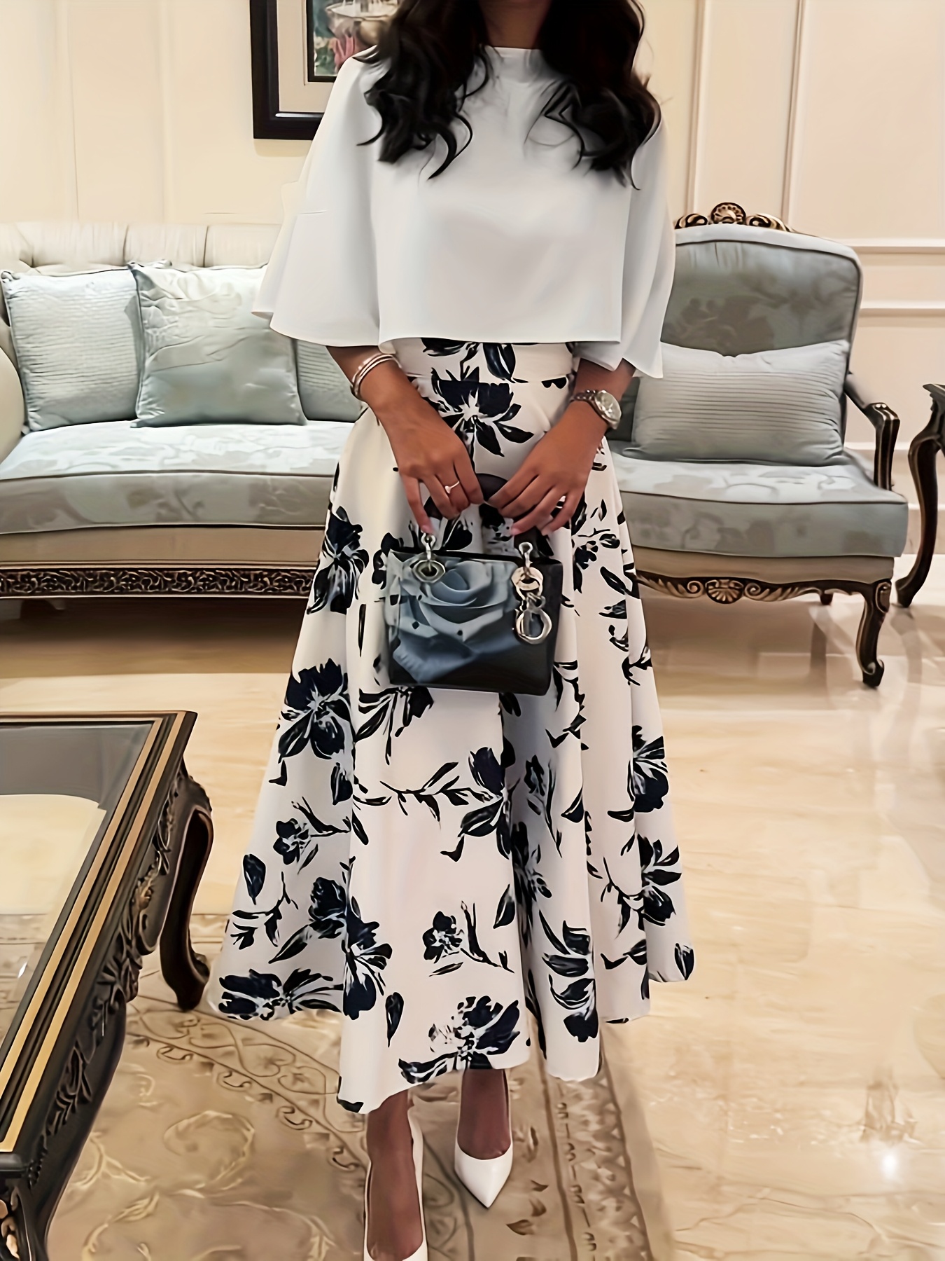 Newnesss elegant Mediterranean Escape Floral Print Dress perfect for spring and summer shown in a flattering pose