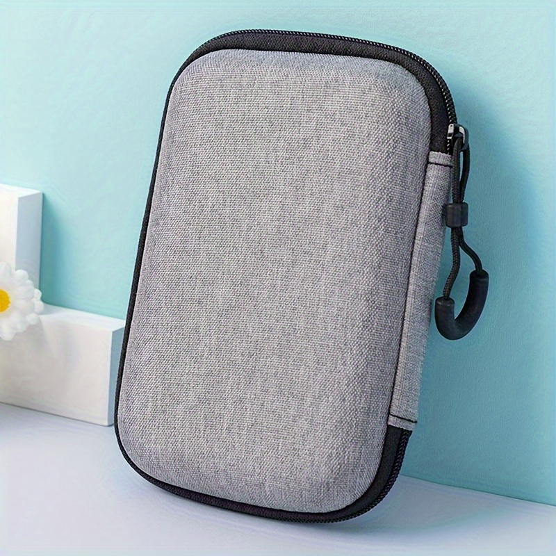 A Storage Bag For Headphones, Wireless Microphones, Portable , And Hard Drives, Designed For Multiple Uses