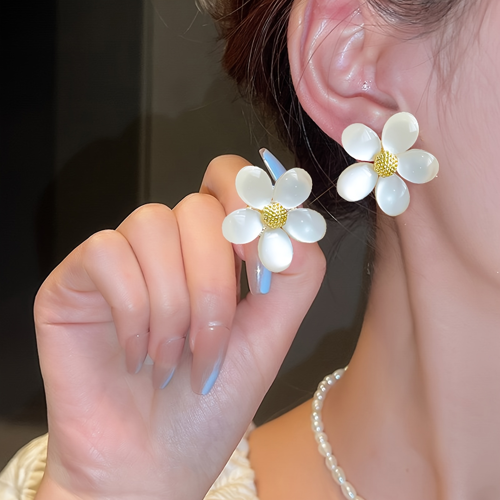 white flower earrings sold on Temu United States