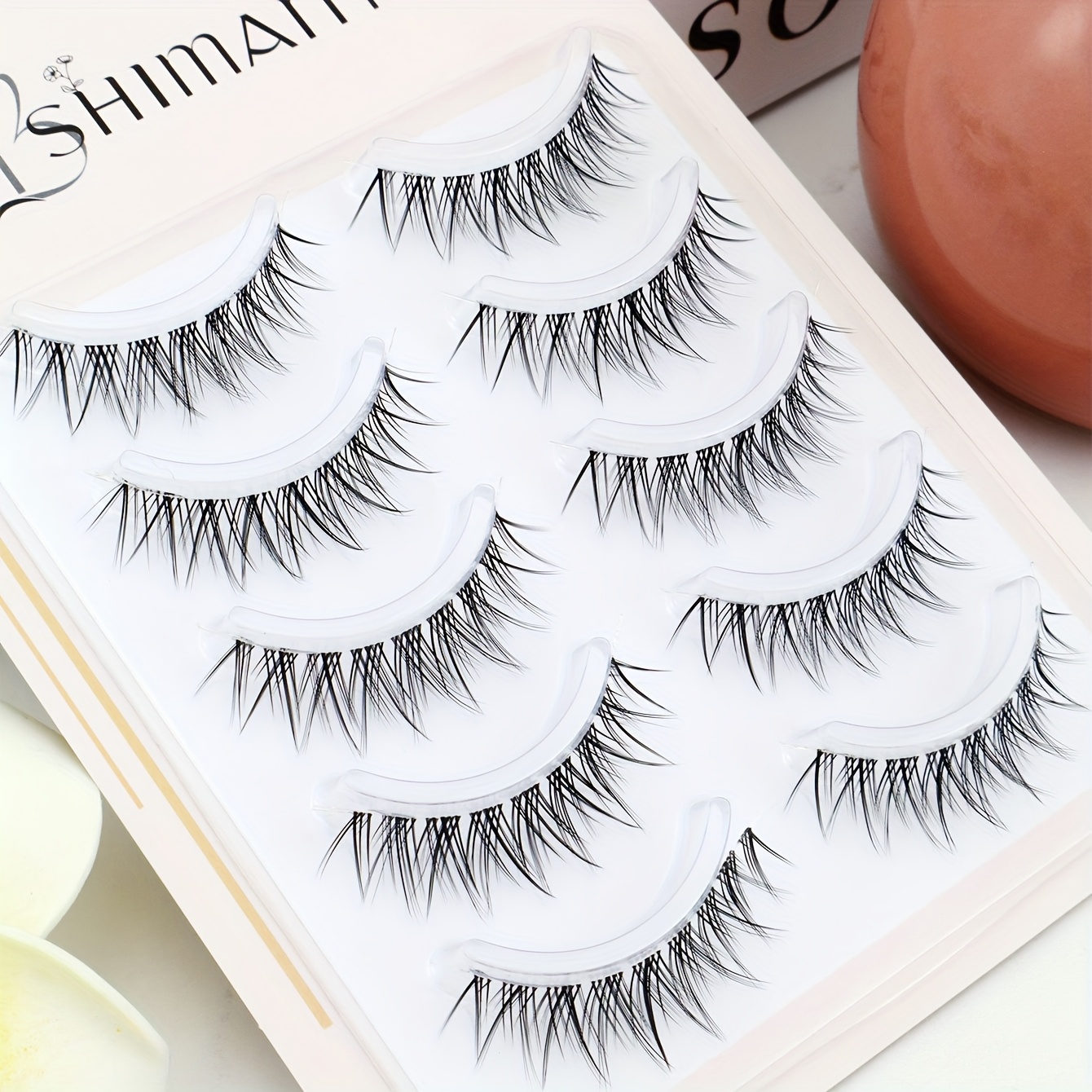 3 Boxes Containing Pairs Of Pointed Tail Comic Eyelashes With Invisible Transparent Stems. Simulated Eyelashes And Trimmed To Suit Different Occasions, Perfect For Complementing Everyday Eye Makeup