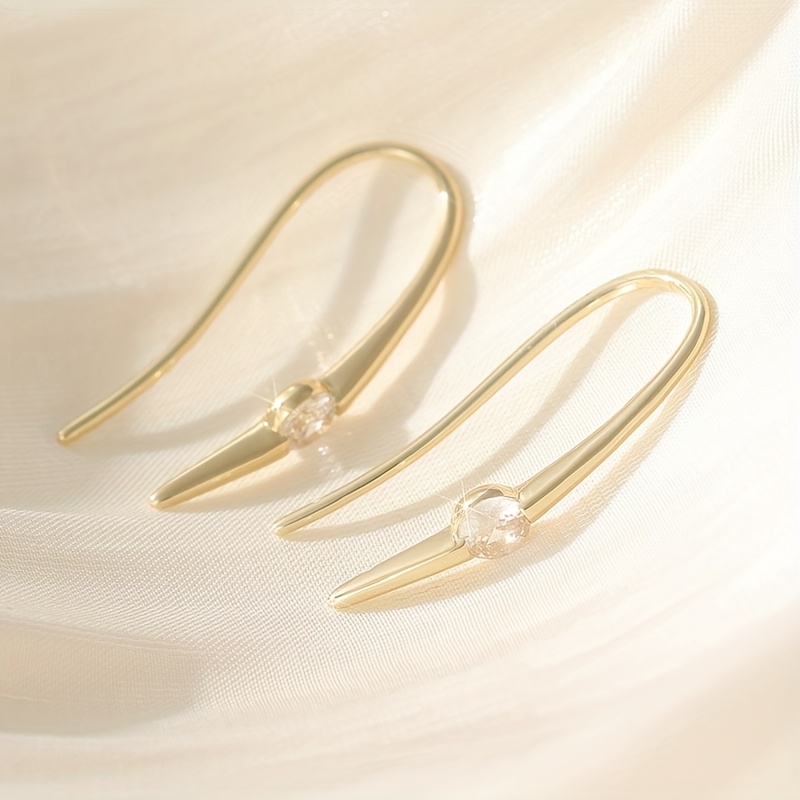 Image of Sleek Golden Jewelry, Suitable For Daily Wear And Parties, Featuring Elegant Ear Studs For Women, Perfect For Any Occasion Throughout The Year