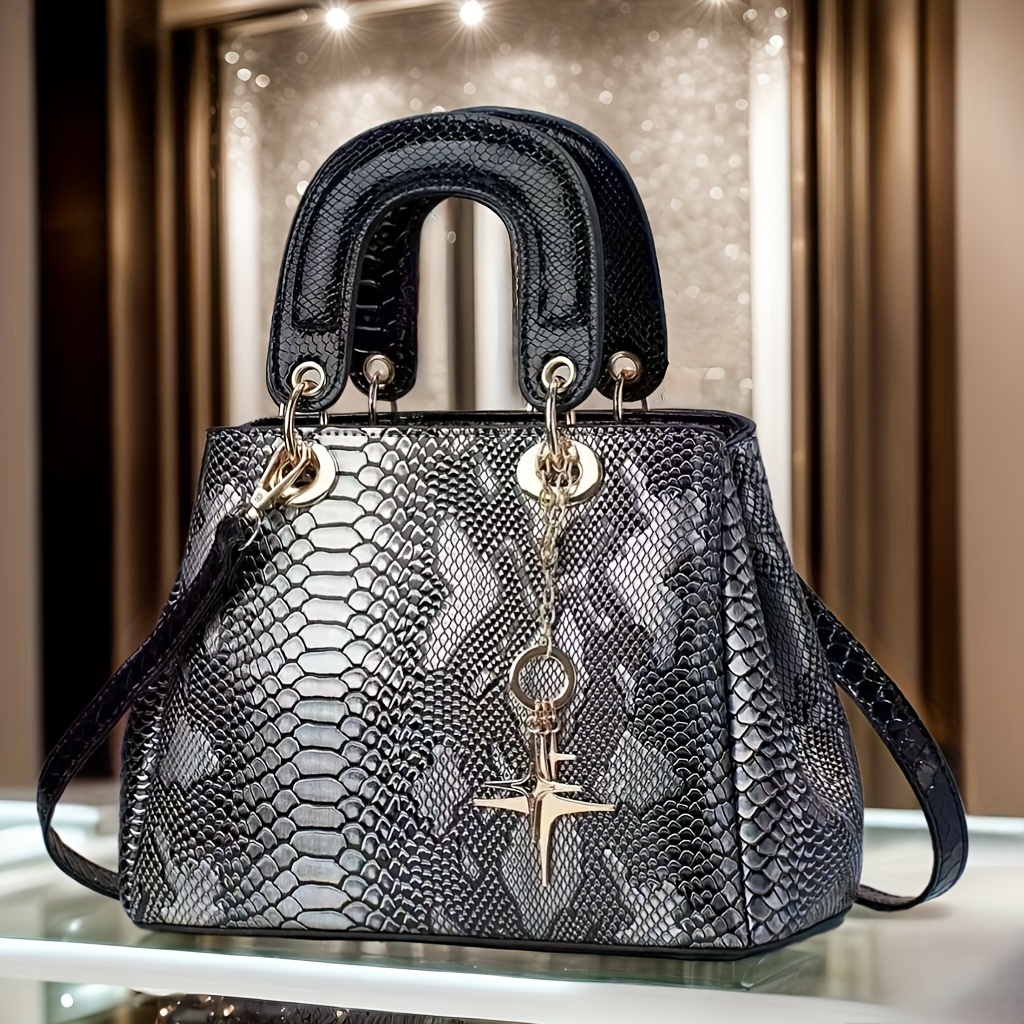 stilvolle damen-handtasche mit schlangenmuster aus kunstleder und