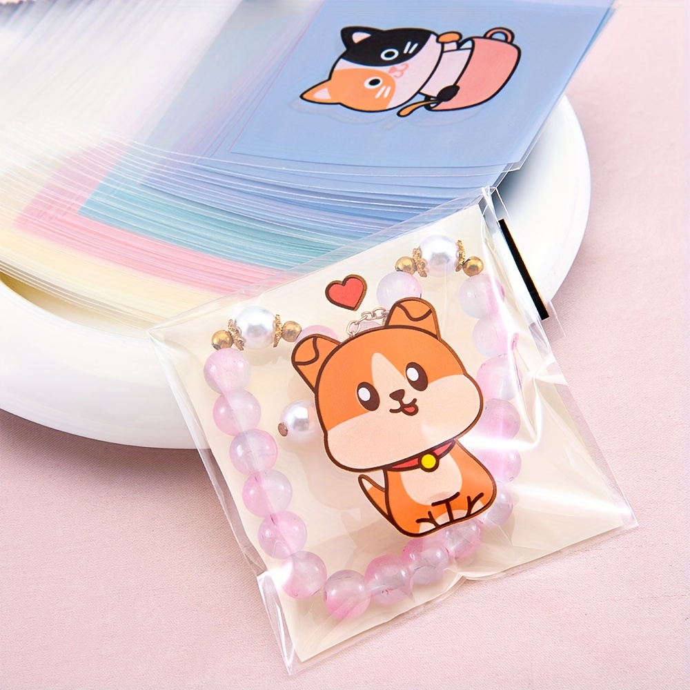 

50pcs Mingxuan Cartoon Animal Print Self-adhesive Opp Bags, Transparent Plastic Jewelry Packaging, Display Storage For Handmade Crafts, Weather-resistant, Under 3.2 Cubic Feet & 27 Inches High