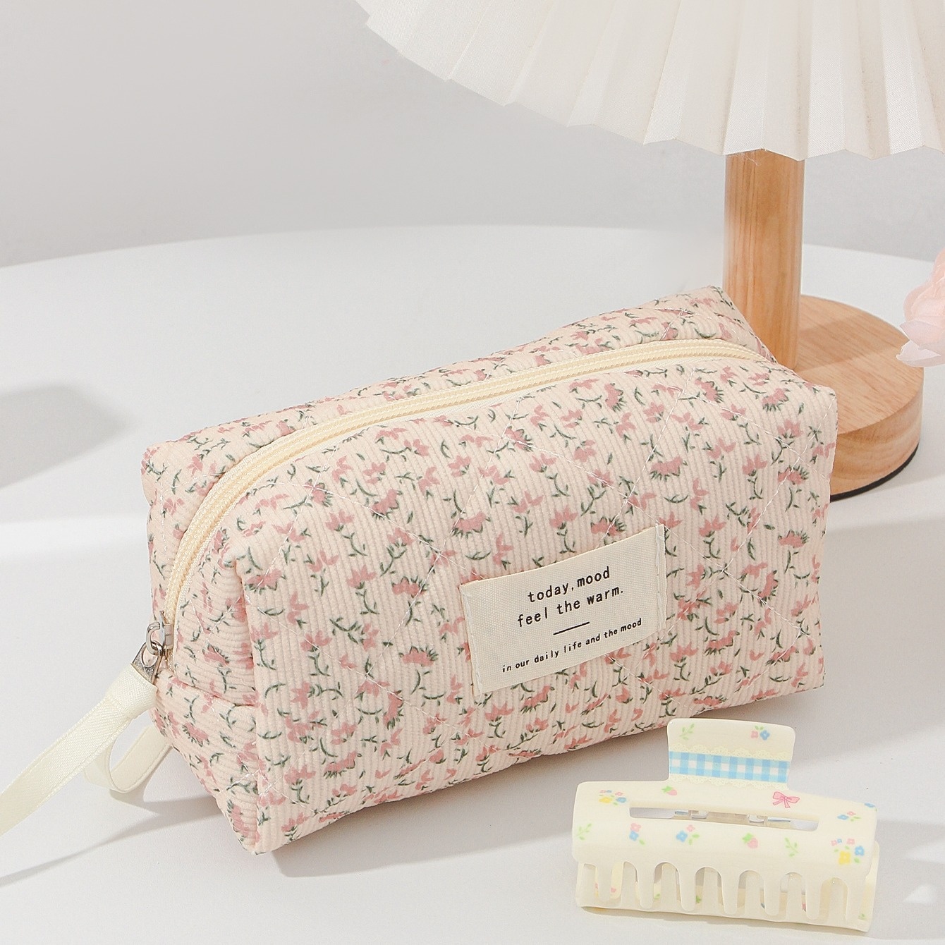 Image of A Single Piece Of A Pink Floral Corduroy Purse Designed For Uses, Featuring A Zipper Closure For Storing Cosmetics, Brushes, Skincare Items, Mobile Phones, , And Other Small Household Items