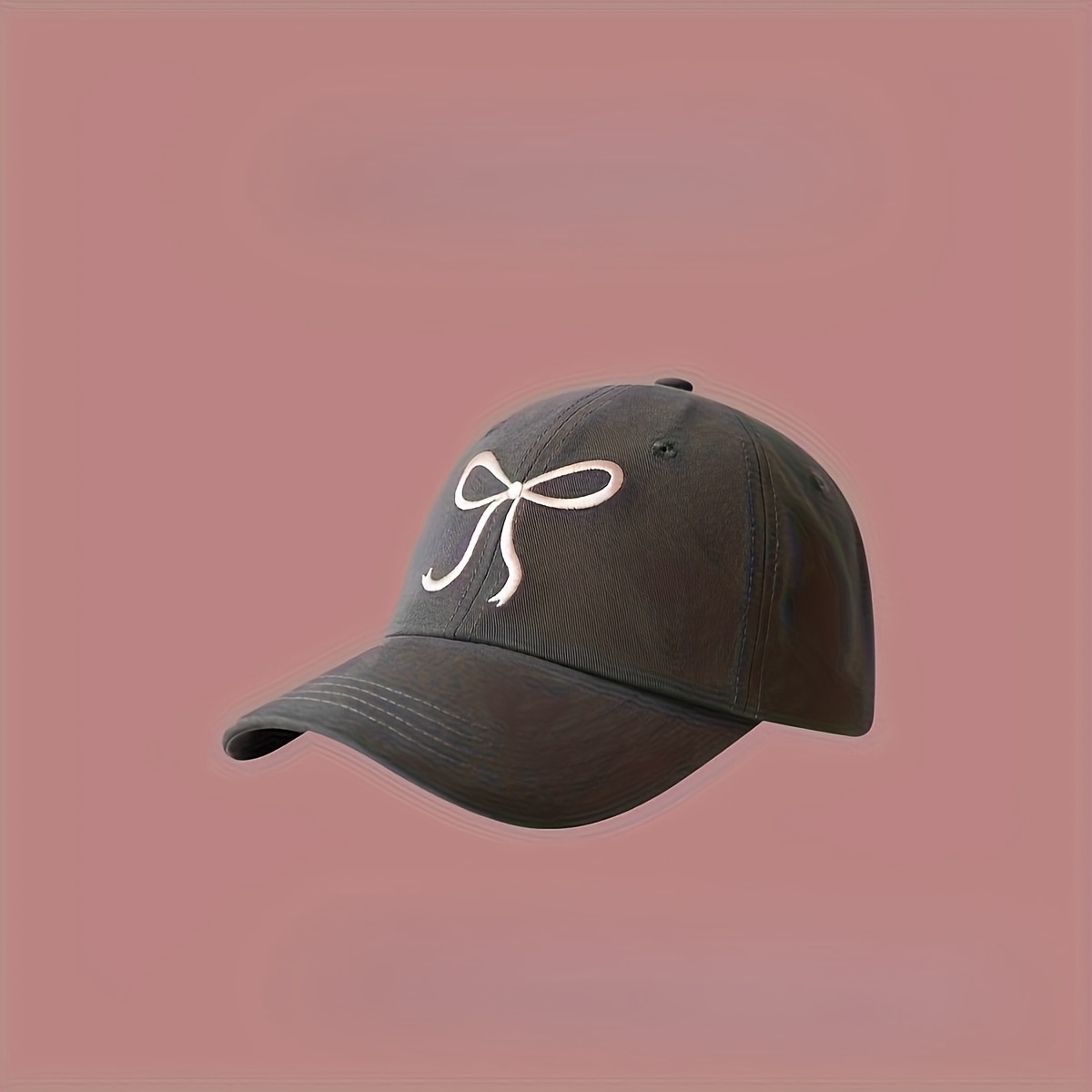 a black baseball cap featuring a pink bow embroidery - Temu