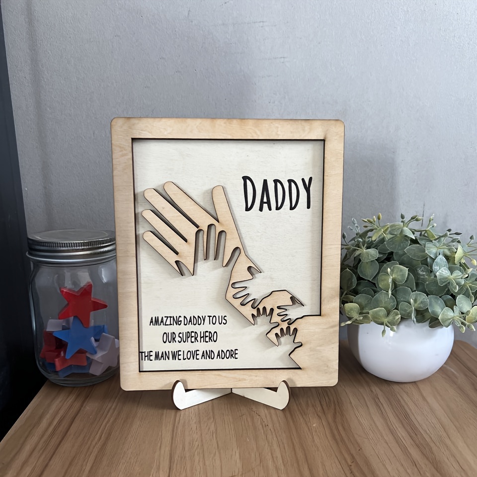 1pc fathers day wooden sign palms intertwined wooden plaque with base gift for dad grandfather amazing daddy to us our super hero the man we love and adore decorative ornaments home decor interior decor living room and bedroom details 5