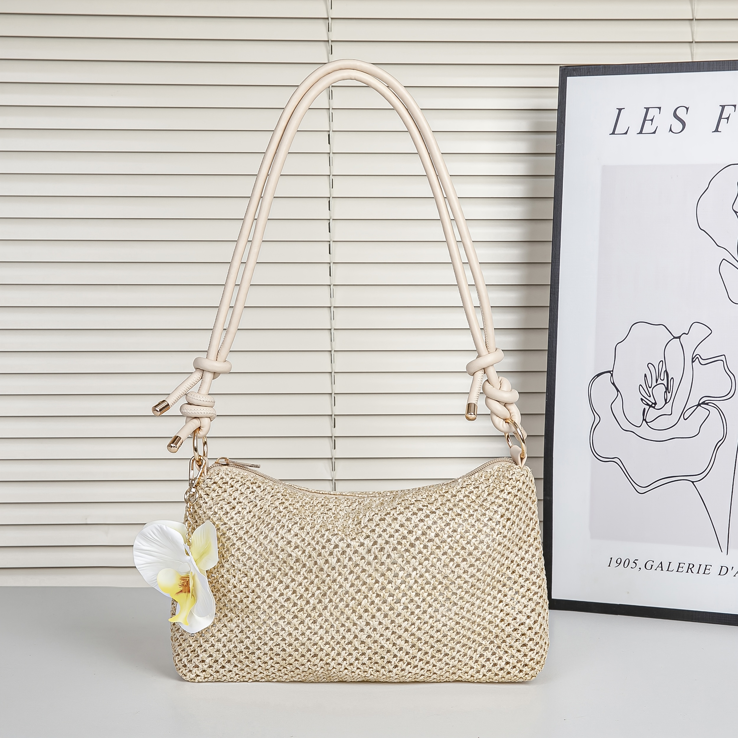 Image of A Women's Lightweight Woven Straw Bag With A Metal Chain, A High-end, -back, And Fashionable Style. This Spacious Beach-themed Bag Is Perfect For Vacation And As A Single-shoulder Or Underarm Bag