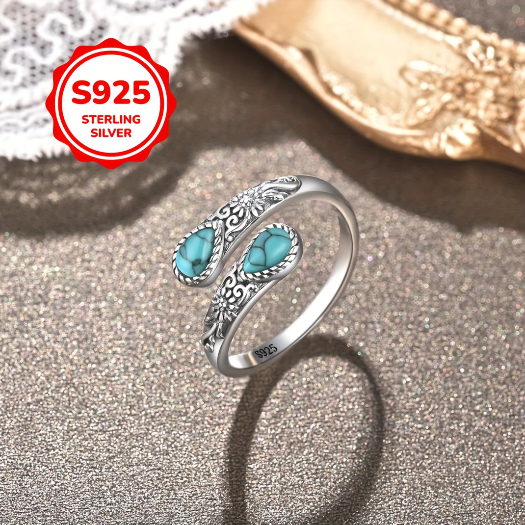 

A Daisy Design Ring S925 Silver, Set With 2 Teardrop-shaped Turquoise Stones. This Vintage-style Adjustable Is Suitable For Wear And Gifting, With A Low Allergy Silver Weight Of 2.4g.