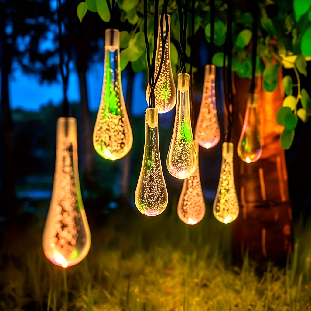 a set of 50 led solar outdoor string lights christmas decorations landscape lights water drop lights raindrop string lights ip65 protection grade abs material suitable for courtyards gardens and outdoor decoration scenes