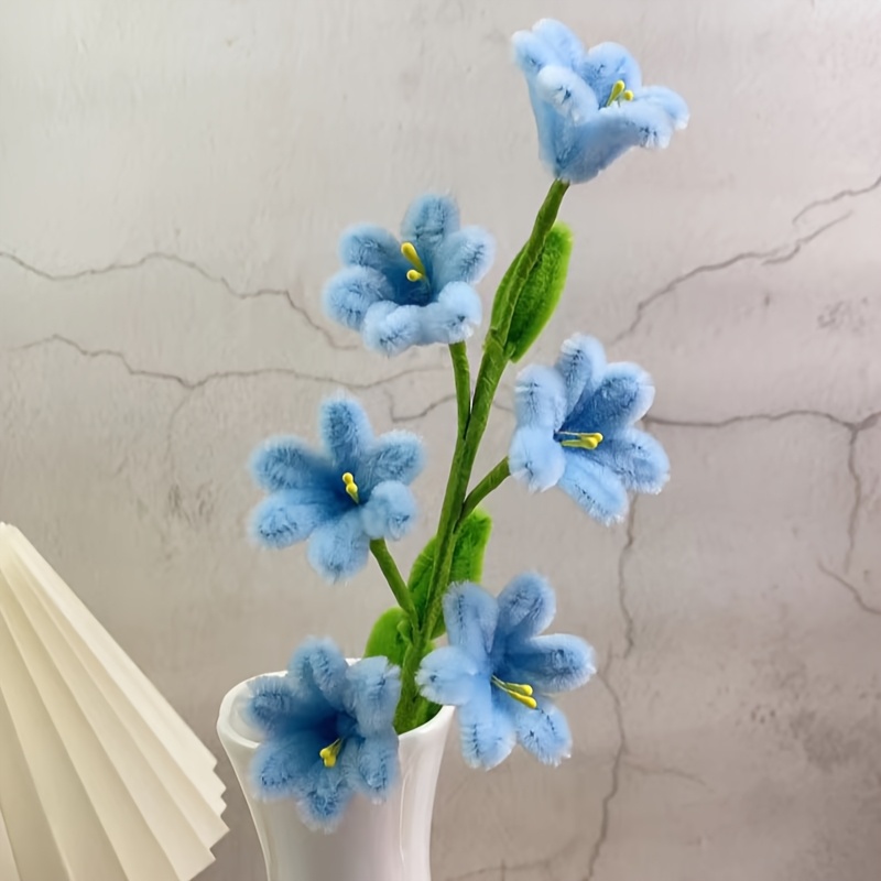 Light Blue Lily of The Valley Handmade Twisting Flower Materials: 36 Light Blue Stems, 15 Green Stems, 4 Green Flower Rods, a Roll of Paper Tape, And 20 Flower Centers. The Light Blue Bellflower Symbolizes Beauty.