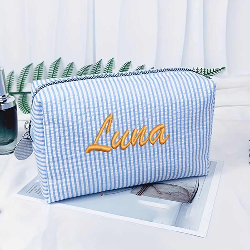 E-shop Zweifarbige gestreifte Bubble Gauze modische High-End Kosmetiktasche, Aufbewahrungstasche, Federmäppchen, Stickerei mit individueller
