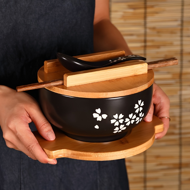 a set of black ceramic bowls with spoons chopsticks and lids   ramen bowls korean soup   and   utensils