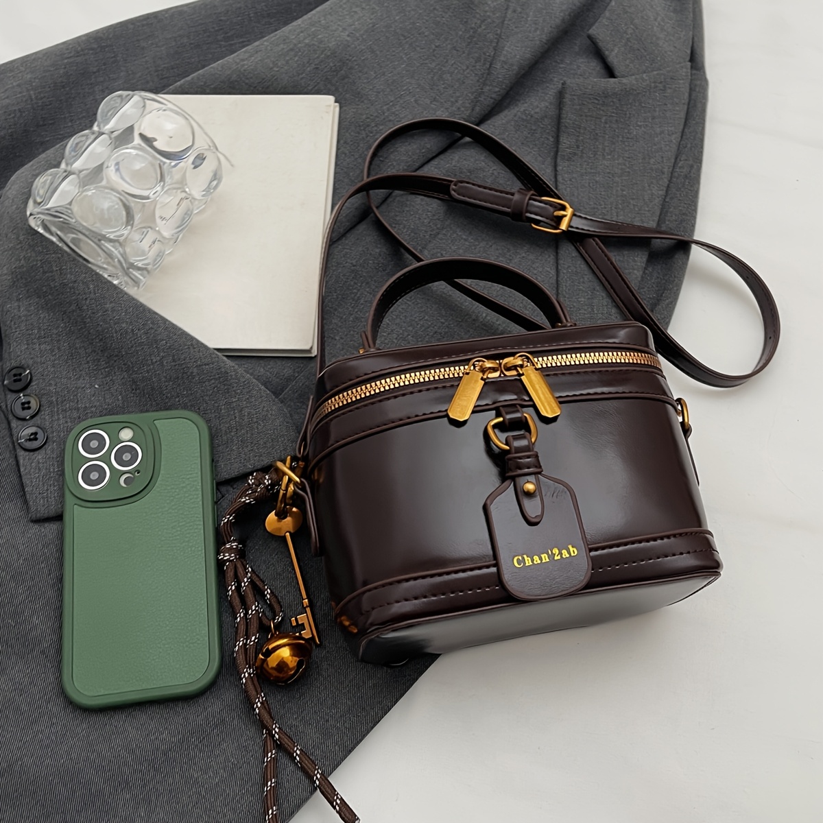 Elegant Retro Women's Crossbody Bag with Bell Pendant – Stylish Brown Handbag with Adjustable Strap, Zipper Closure, and Golden-Tone Hardware for Work, Date, Shop, and Party