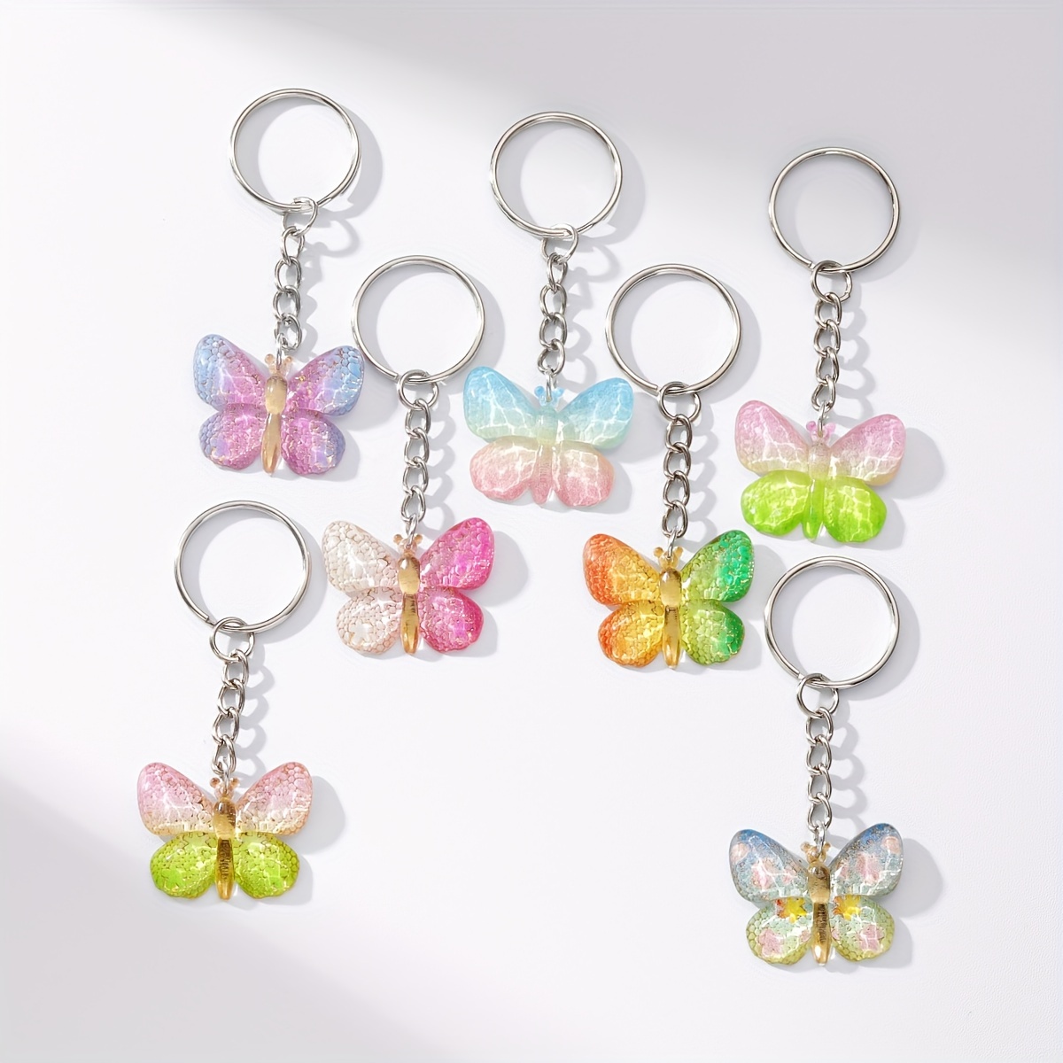 E-shop 7-teiliges personalisiertes hängendes Harz, farbenfrohes Schmetterling-Schlüsselanhänger-Taschenanhänger, niedlicher