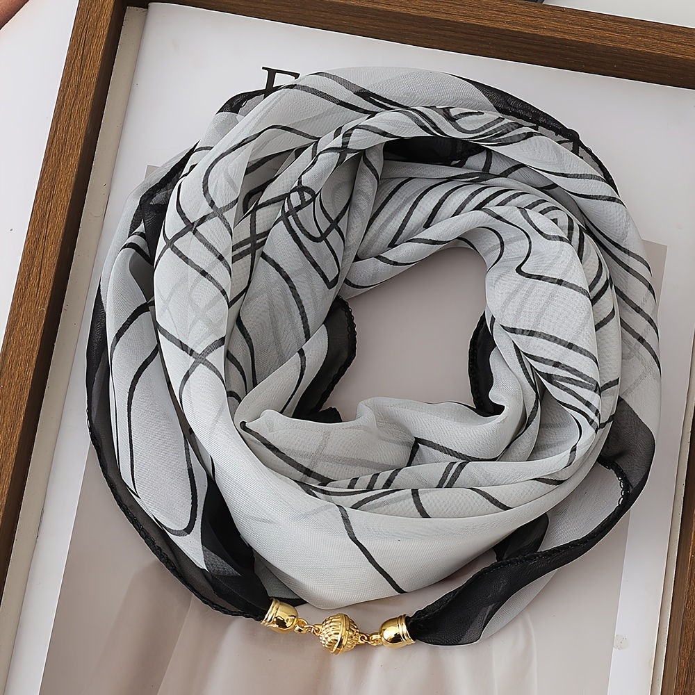 a lightweight printed scarf with magnetic clasp a convenient and stylish neck accessory made of 100 polyester a decorative scarf for women suitable for  