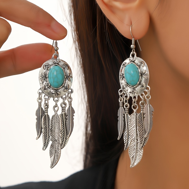 

A Pair Of Ethnic Style Bohemian Style Ladies' Earrings With Turquoise Decoration And Feather Design, Featuring Golden Tassels, Vintage Distressed Style Ladies' Long Earrings.