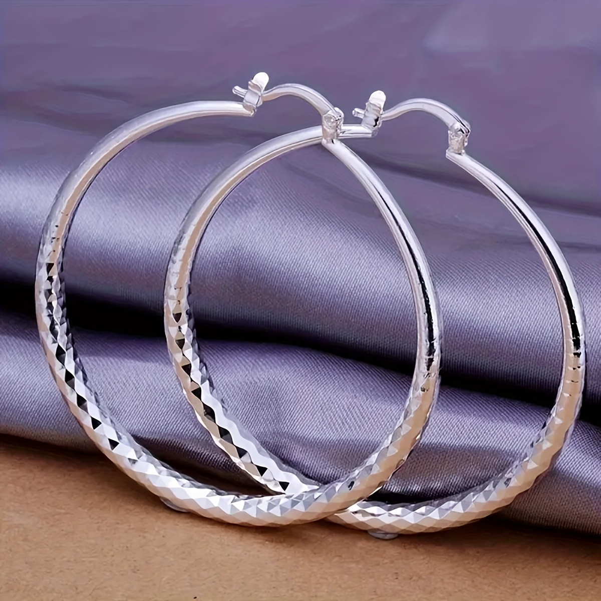 

A Pair Of Large Earrings, An Elegant Ladies' Accessory In Style, Women To Wear On A Daily .