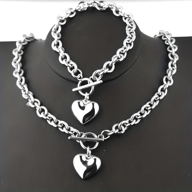 

Ensemble Bracelet et Collier pour Femme en Acier Inoxydable avec Pendentif Cœur et Boucle OT, 2 pièces, Style Décontracté pour Soirée