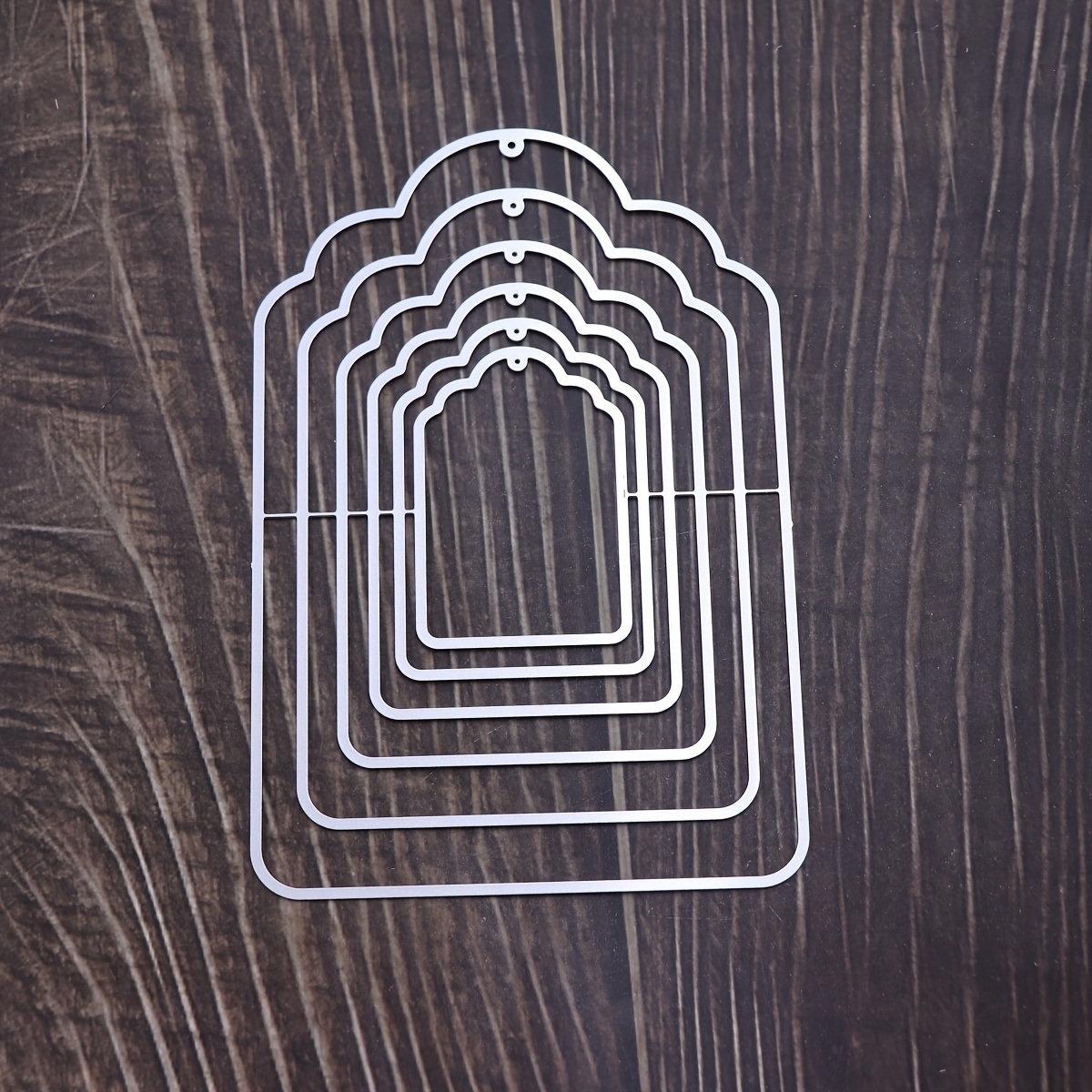 A Bookmark Cutting And Embossing Knife Mold In Golden Color.