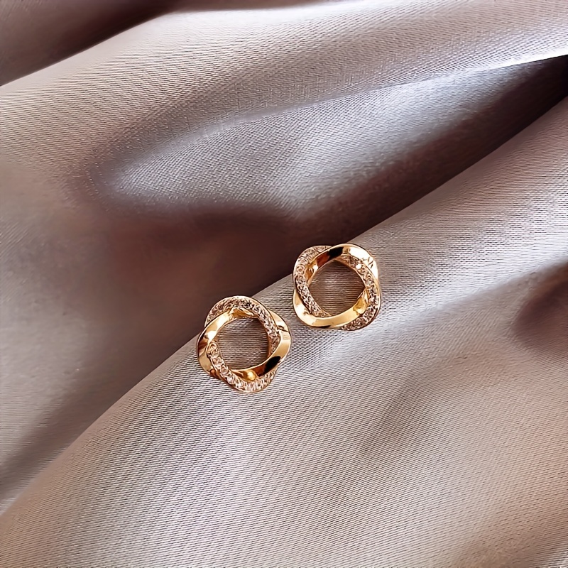 Alloy Circle Stud Earrings with Rhinestone Detailing and Stainless Steel Post