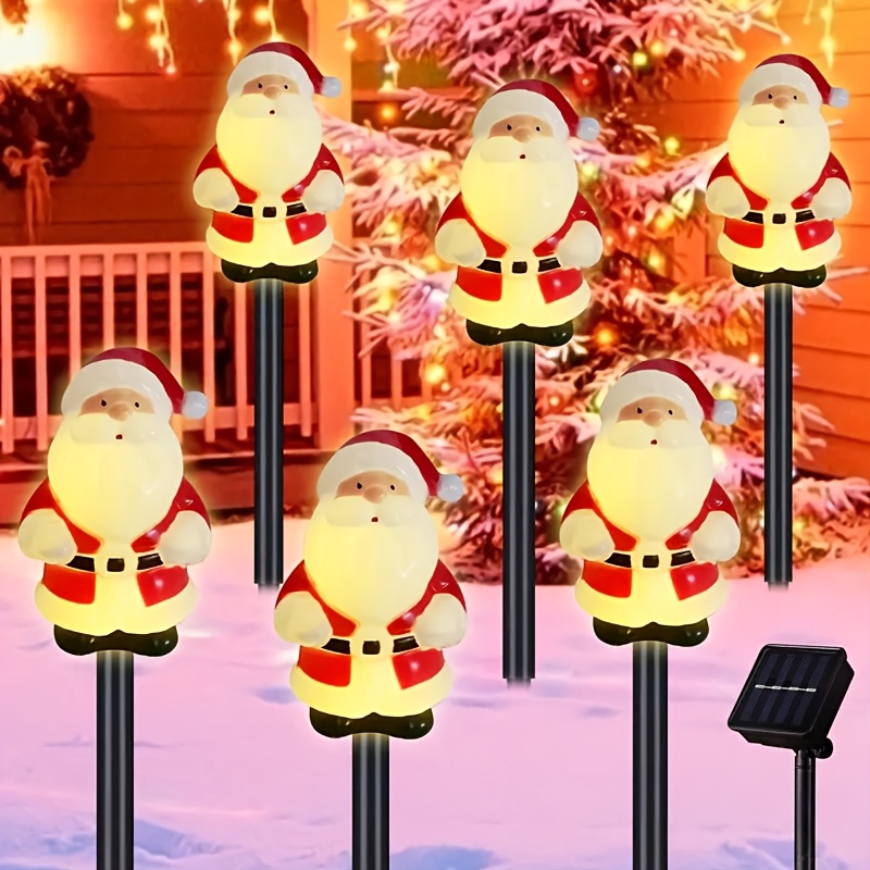 

Lot de 5 piquets de jardin solaires Père Noël, décorations de Noël d'extérieur en plastique avec chargement solaire, batterie au nickel 600 mAh, télécommande