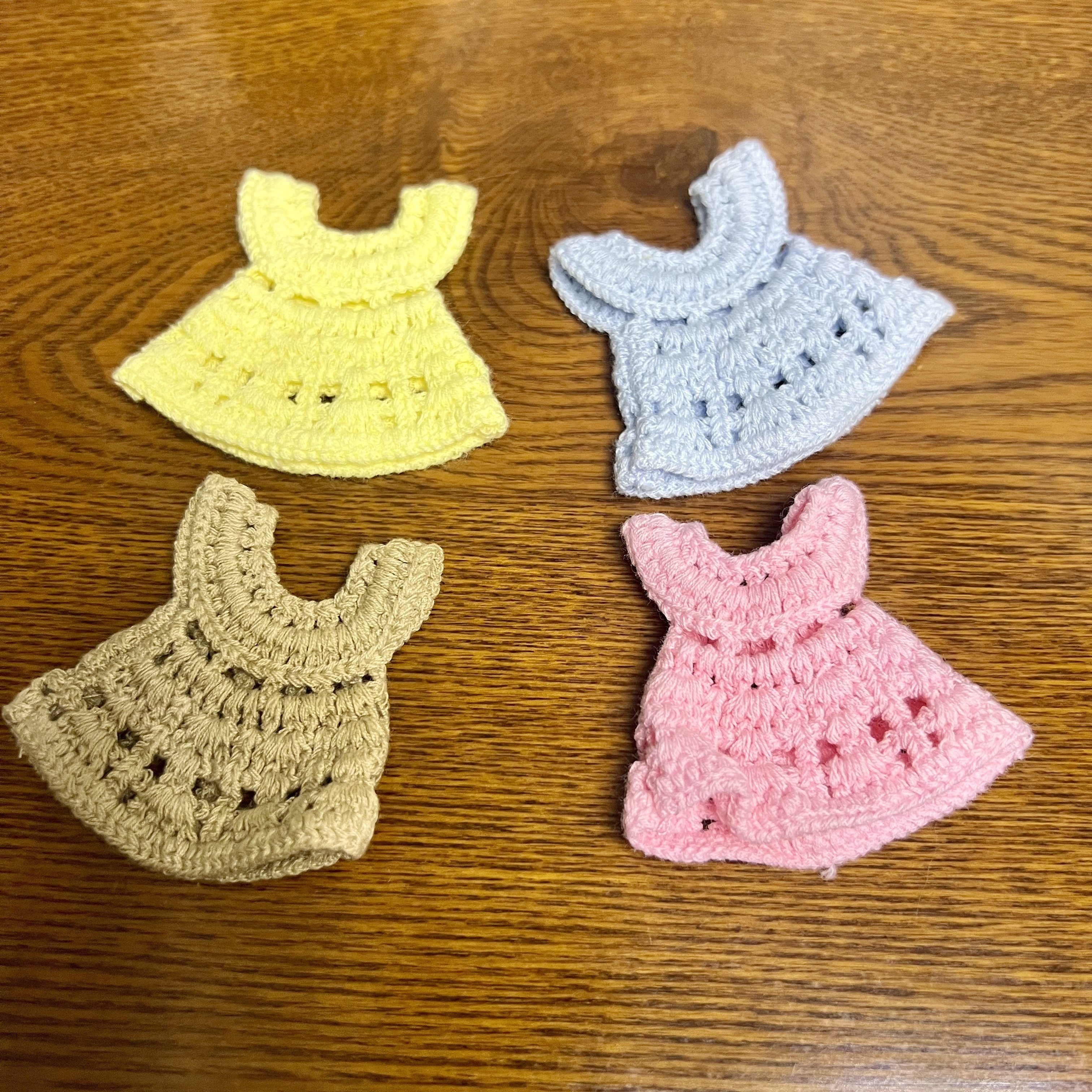 

4pcs Crochet Sweater Dresses For Small Pets - Cozy Polyester Hamster & Mouse Outfits In Yellow, Blue, Brown, Pink With Star Patterns, Home Decor