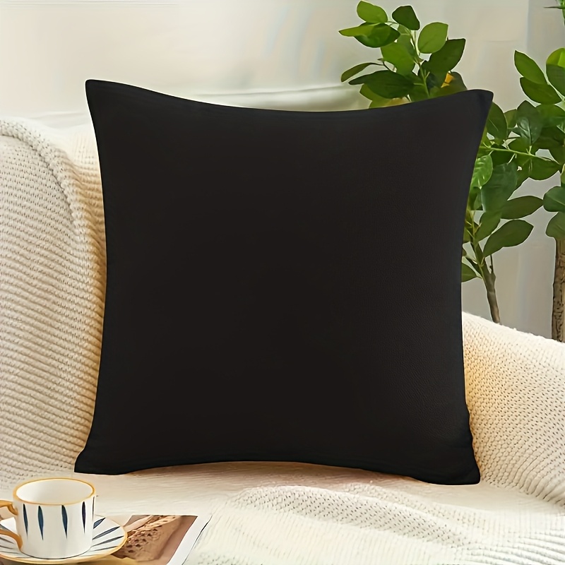 

Un ensemble de taie d'oreiller carrée décorative en velours noir et de avec coussin pour canapé, chambre à coucher et