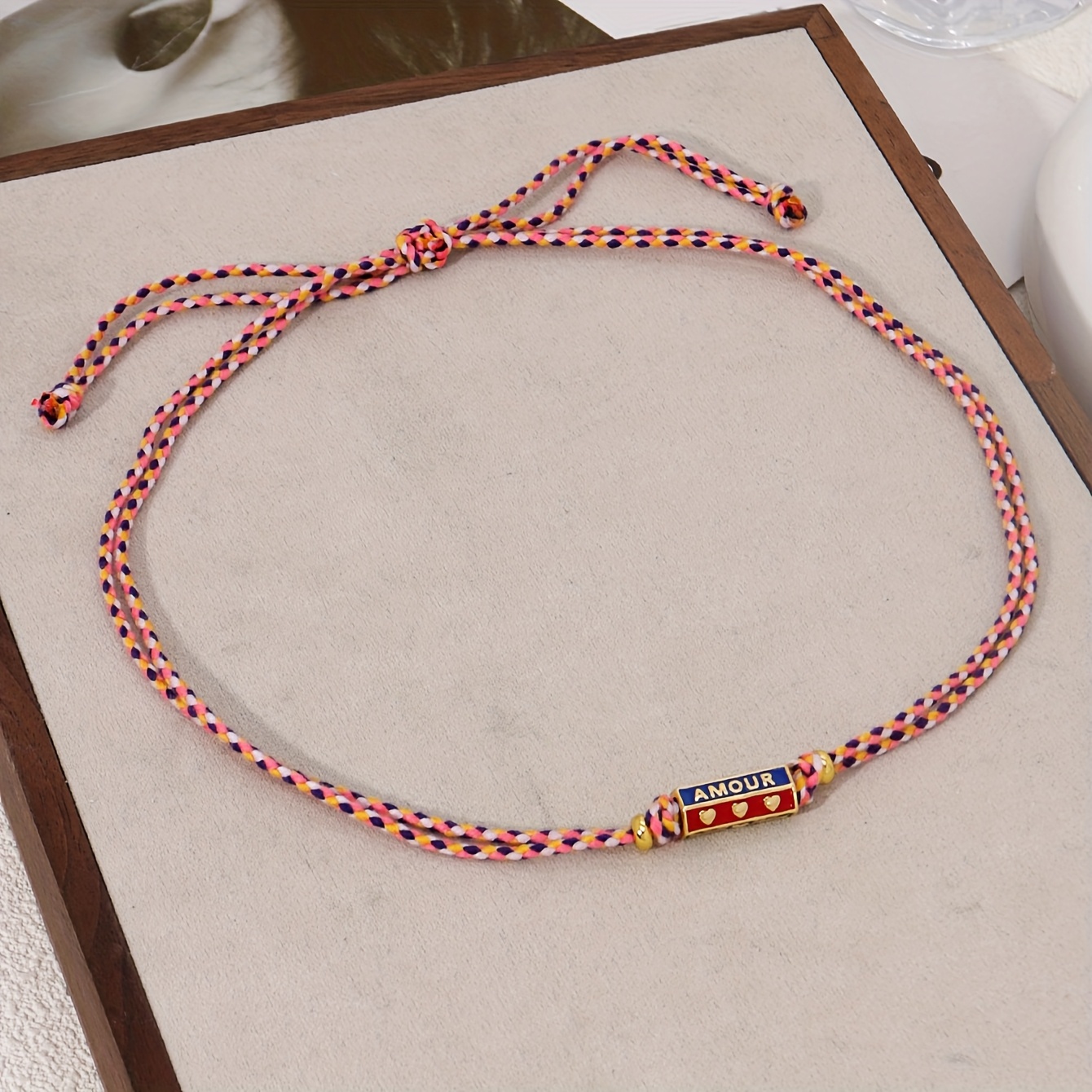 Image of A Women's Stylish Line Necklace Featuring An Ethnic Metal Carved Letter, A Pendant With A Colorful Handmade Woven Design, Perfect For Party Holiday Jewelry Additions