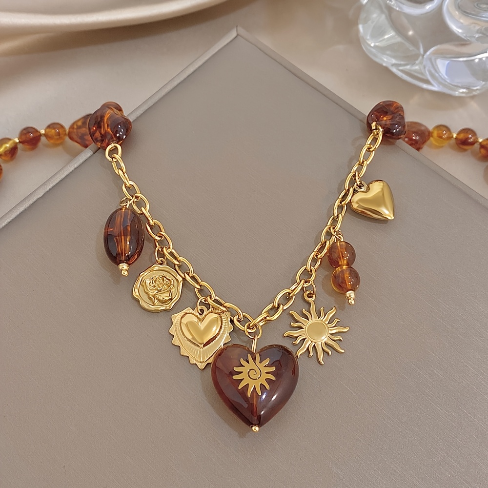 TEMU 1pc Collier avec Pendentif Cœur et Soleil Élégant et Tendance, du Punk, du Gothique et de l'Aesthétique "Style Instagram". Fabriqué en Acier