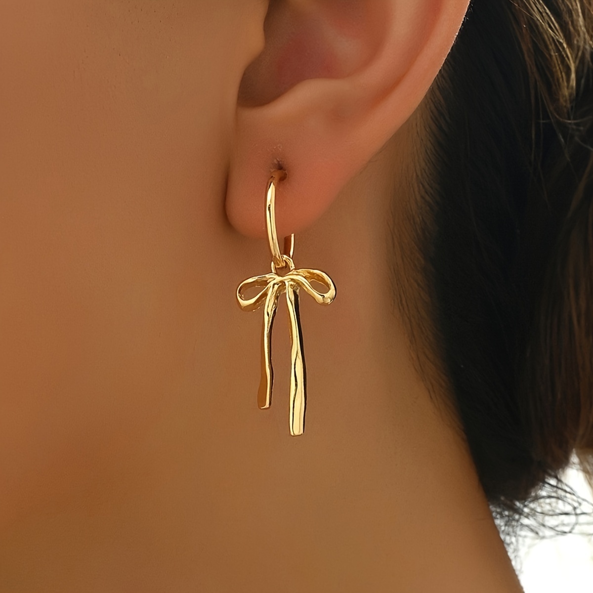 

A Pair Of Ballet Bow Draped Earrings