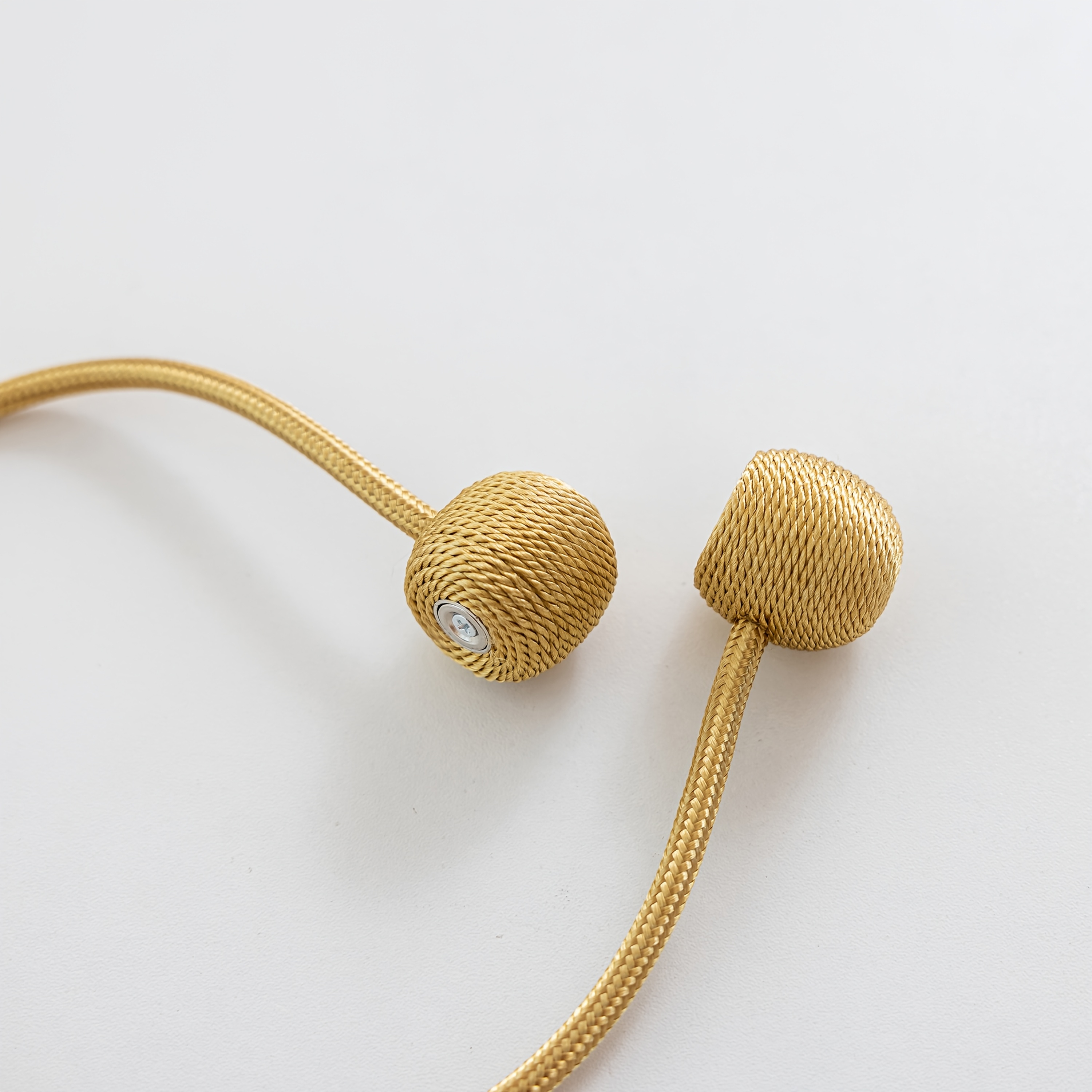 A Set of Two Modern Minimalist Magnetic Curtain Ties Is on, Featuring Thicker Twisted Ropes And Flexible Magnetic Ties. They Are Durable, Easy to Install, And Do Not Require Drilling, Making Them Perfect for Bedroom And Living Room Decor