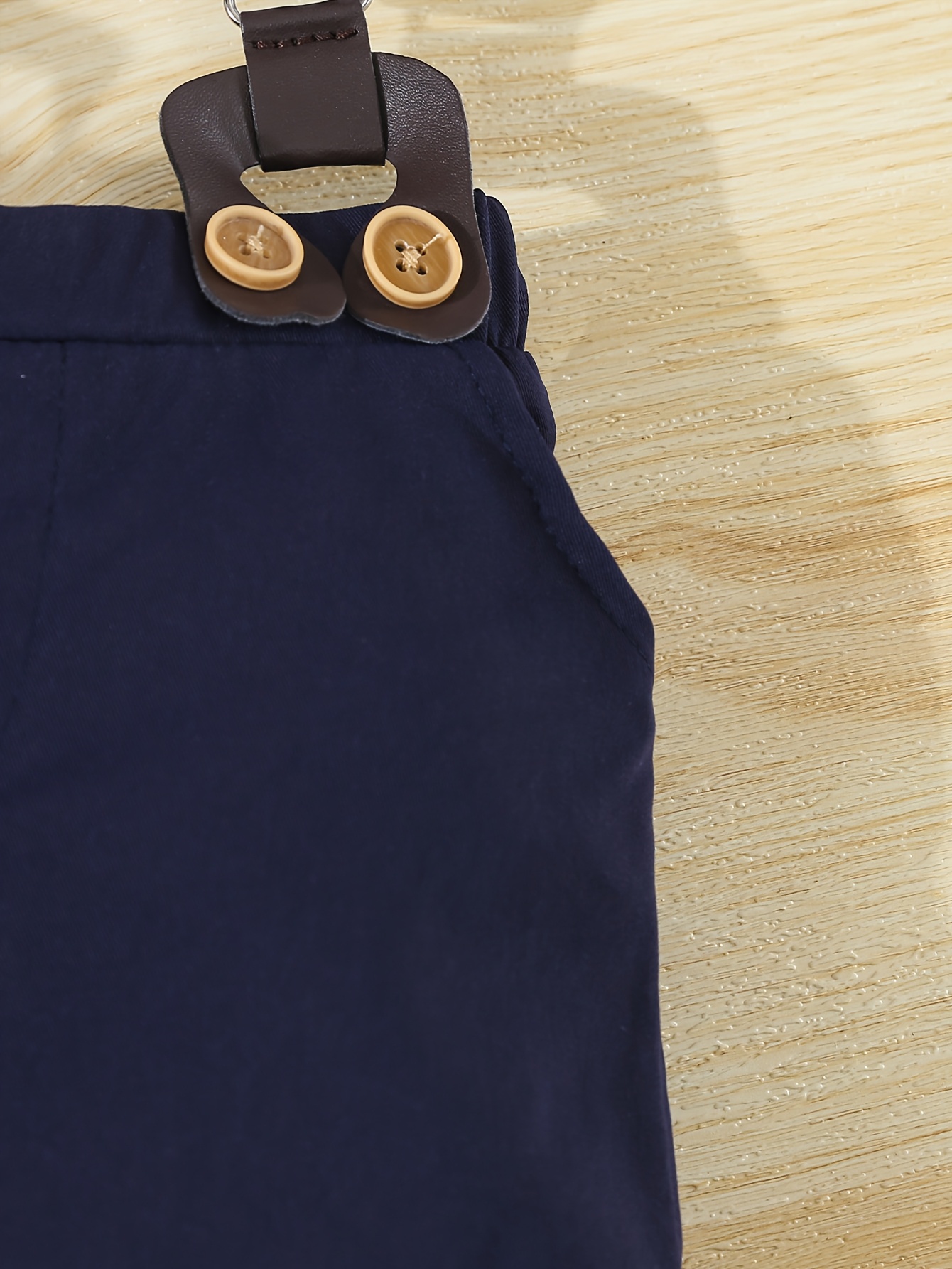 a formal three piece gentleman outfit for baby boys featuring a short sleeve shirt with geometric patterns and a bow tie shorts with suspenders and a   hat stylish and   its a   for summer birthday parties Product details 7