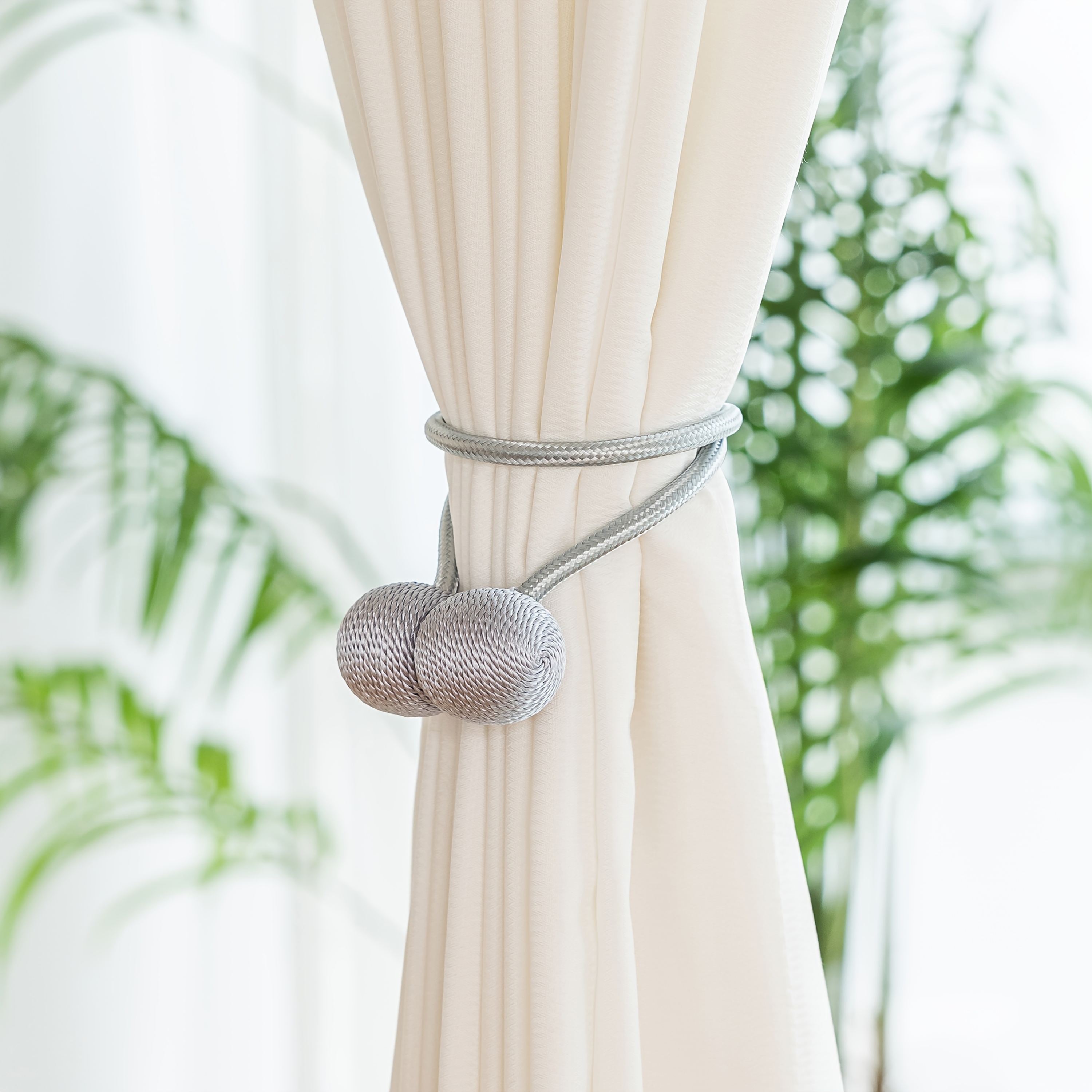 A Set of Two Modern Minimalist Magnetic Curtain Ties Is on, Featuring Thicker Twisted Ropes And Flexible Magnetic Ties. They Are Durable, Easy to Install, And Do Not Require Drilling, Making Them Perfect for Bedroom And Living Room Decor