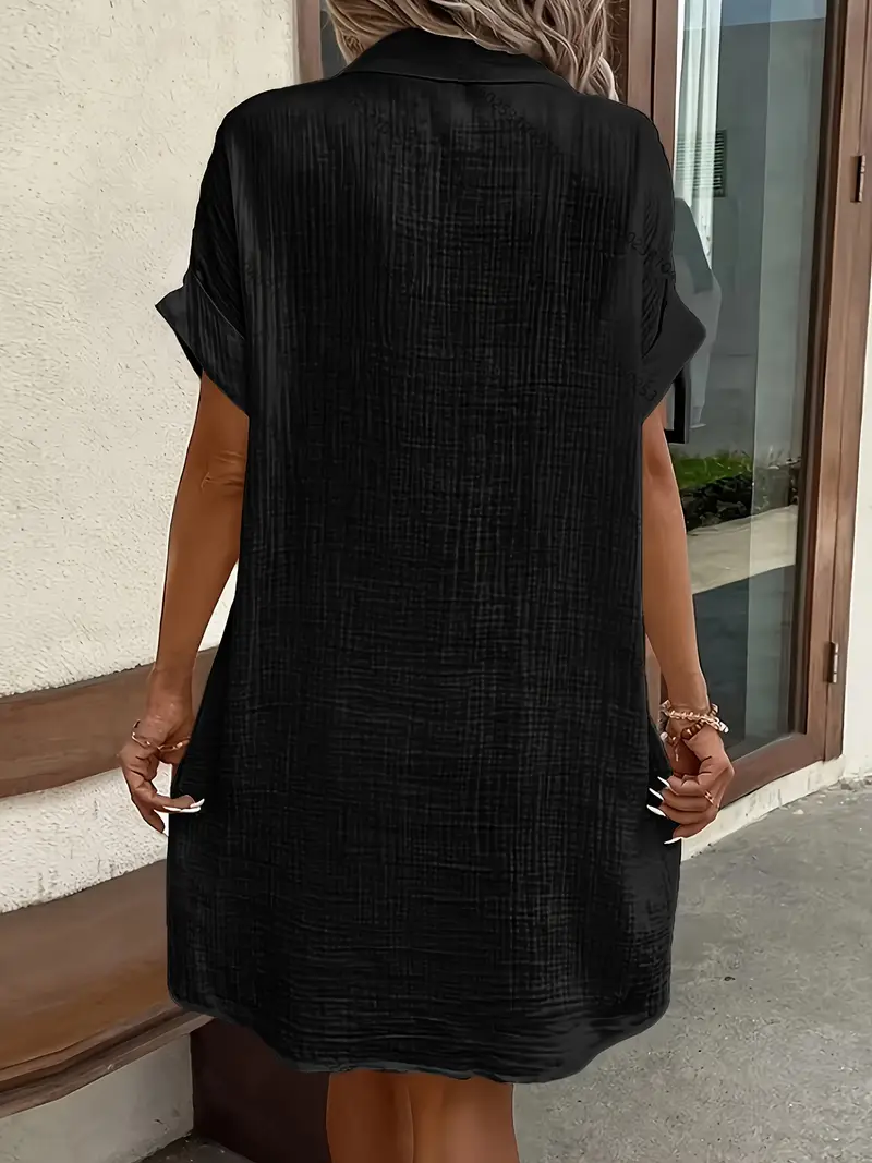 a minimalist white shirt dress made of breathable featuring a sharp collar design and buttons that add a touch of details 16