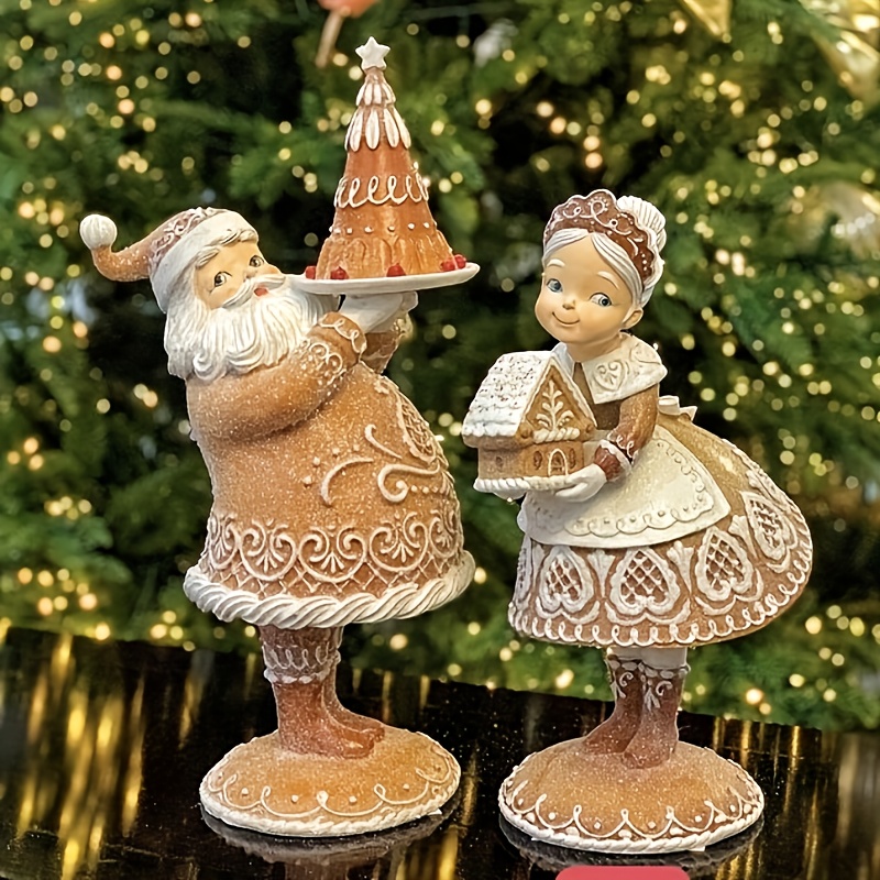a set two resin statues featuring santa claus mrs claus - Temu
