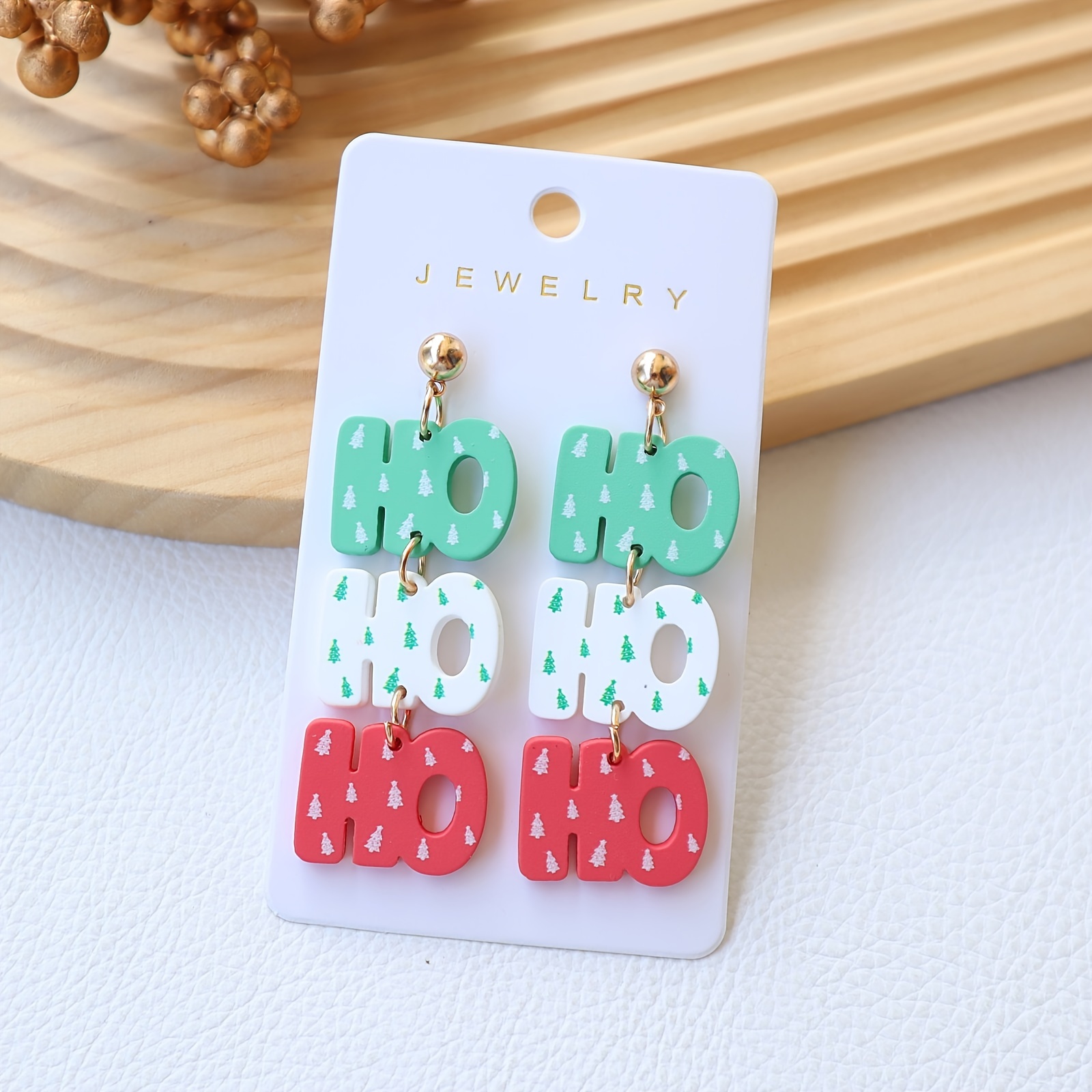 Image of A Pair Of Christmas Acrylic Earrings With A Soft Clay Feel, Featuring Ho Letters And Cute Christmas Tree Prints, Perfect For Holiday Parties And Gifts