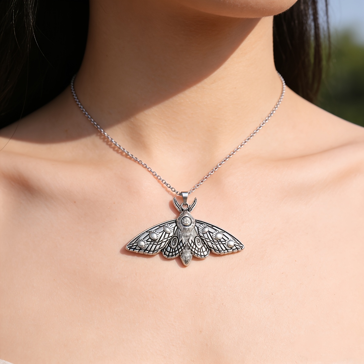 Vintage Distressed Moth Pendant Necklace, With Precise Textures Outlining A Mysterious Wing Form, Exuding A Dark Artistic Vibe. It Symbolizes Transformation And , Representing Force Of From Shackles