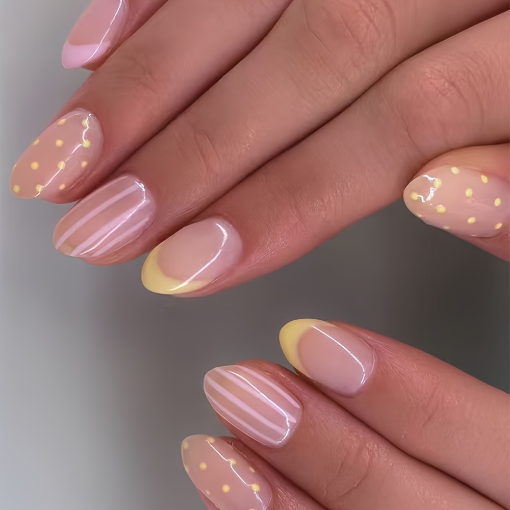 24pcs Of Short Oval False Nails In A Sheer Pink Base With Yellow Accents In A French Style, With Polka Dots And Vertical Stripes, Create And . Are The Skin Tone And Suitable For Daily Commutes