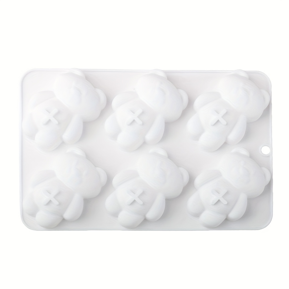 A White Silicone Baking Mold Shaped Like A , Suitable For Handmade Cake Decorations, Desserts, Mousse, And Pudding. Made From Food-grade Silicone, It Ensures Safe Baking For Your .