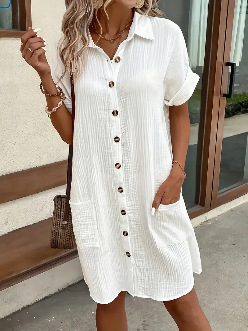 a minimalist white shirt dress made of breathable featuring a sharp collar design and buttons that add a touch of details 22