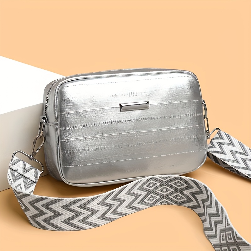 

A Stylish Silvery Mini Shoulder Bag With Wide Shoulder Strap For Women, For Daily , Featuring , Perfect As A Gift For Travel And Daily Use.