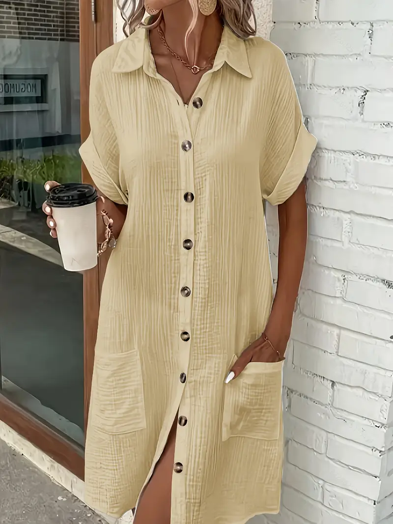a minimalist white shirt dress made of breathable featuring a sharp collar design and buttons that add a touch of details 9
