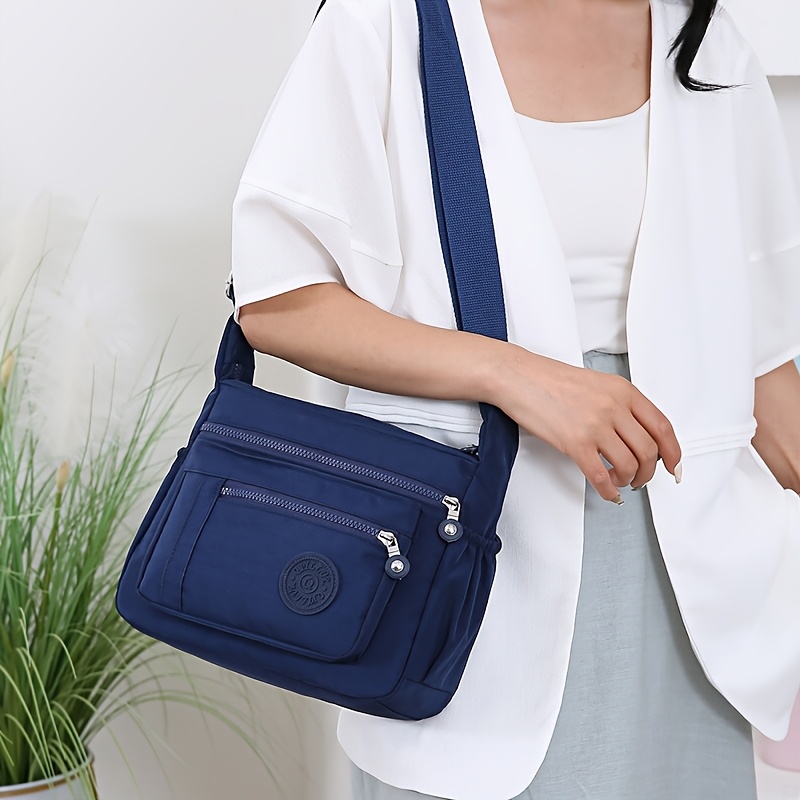 large capacity oxford fabric multi pocket drawstring crossbody bag simple womens shoulder backpack details 3