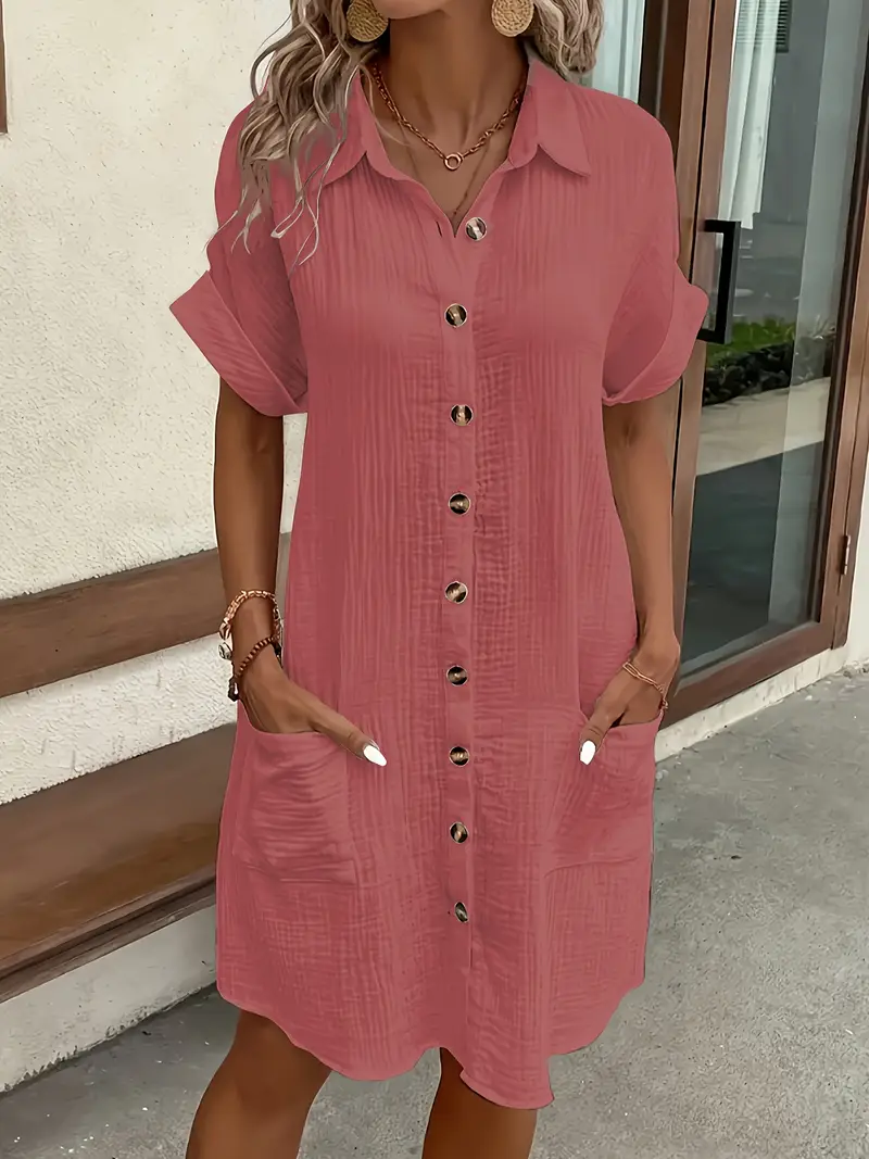 a minimalist white shirt dress made of breathable featuring a sharp collar design and buttons that add a touch of details 2