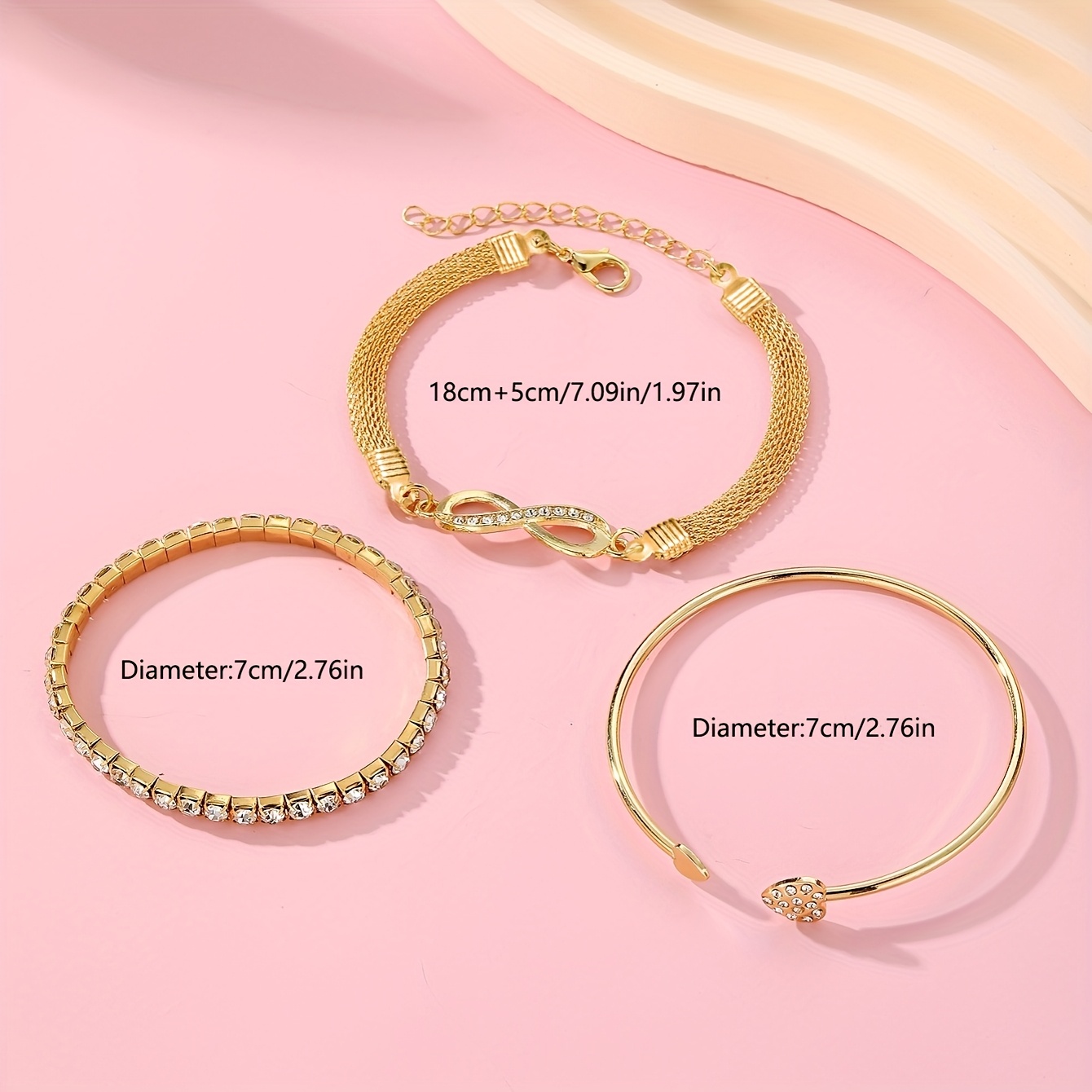 A Set of Three Women'S Bracelets And Bangles Featuring Wireless Symbols And Heart Designs Adorned with Rhinestones.